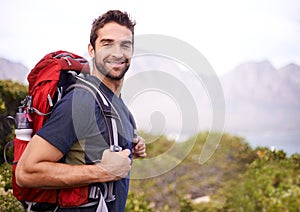Man, happy and hike for fitness with backpack for adventure, workout and hobby to explore in New Zealand. Portrait