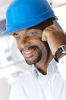 Man in hardhat on call photo