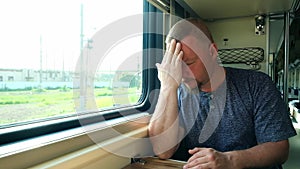 Man has a headache on the train
