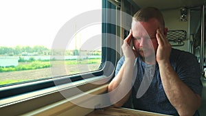 Man has a headache on the train