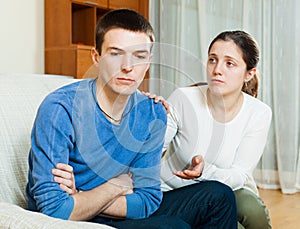 Man has problem, wife comforting him