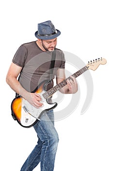 Man with hat and beard play on electric guitar with enthusiasm. Isolated on white