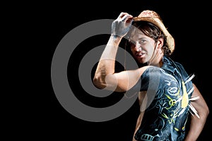 Man in hat with bodyart/body-art isolated on black