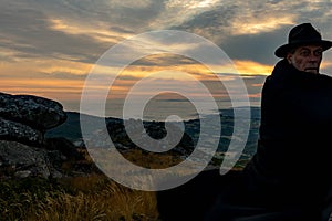 Man with hat and cape