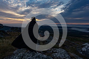 Man with hat and cape