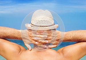 Man with a hat enjoying the sea