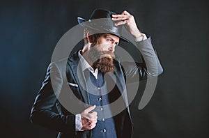 Man with hat. Man well groomed bearded gentleman on dark background. Male fashion and menswear. Retro fashion hat