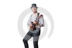 Man with hat plays the mandolin isolated on white