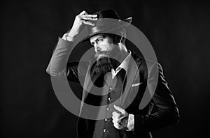 Man with hat. Man well groomed bearded gentleman on dark background. Male fashion and menswear. Retro fashion hat