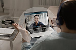 Man have webcam conference on laptop with colleague