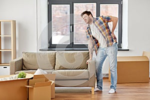 Man having back ache moving to new home