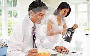 Man Having Breakfast Before Going To Work