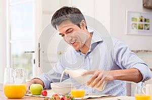 Man Having Breakfast With Milk