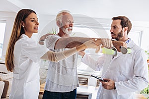 Man having chiropractic arm adjustment.