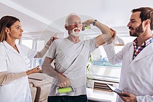 Man having chiropractic arm adjustment.