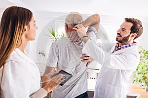 Man having chiropractic arm adjustment.