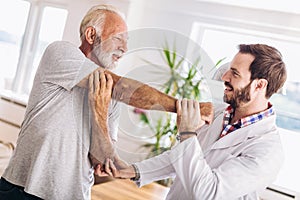 Man having chiropractic arm adjustment. photo