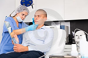 Man having consultation with doctor in clinic