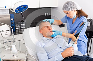 Man having consultation with doctor in clinic