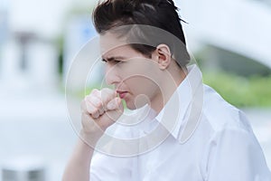 Man is having a cough caused by pollen allergy