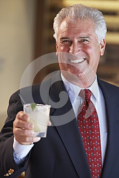 Man Having A Drink At A Bar