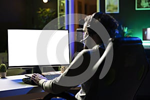 Man having fun by using  screen computer monitor to play game