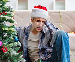 Man having hangover after christmas party