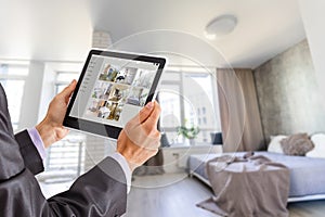 man having Home automation control station in a modern home 3D render