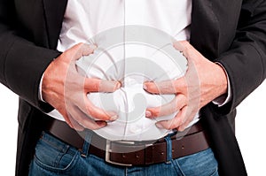 Man having indigestion after a business lunch photo