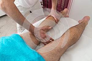 Man Having Legs Massage In A Spa Center