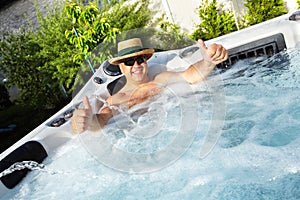 Man having massage in hot tub spa.