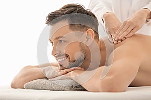 Man having massage in spa salon