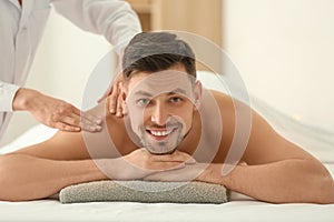 Man having massage in spa salon