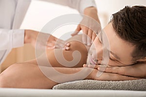 Man having massage in spa salon, closeup