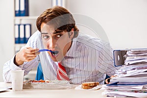 The man having meal at work during break