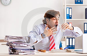 Man having meal at work during break