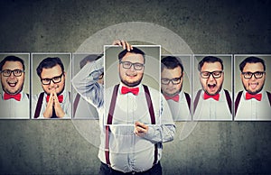 Man having mood swings posing at camera