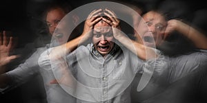 Man having panic attack on dark background