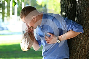 Man having panic attack outdoors