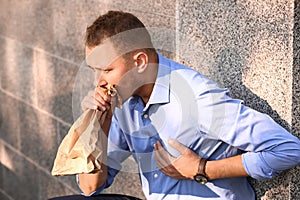 Man having panic attack outdoors