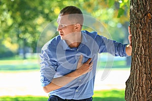 Man having panic attack outdoors