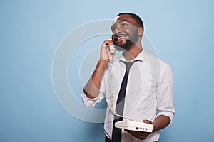 Man having a phone call on a landline