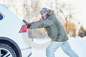 Man having problem with car during snowy winter