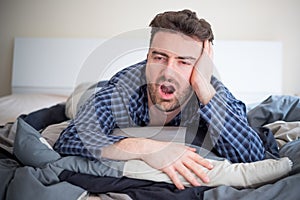 Man having problem sleeping in his bed