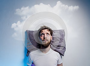 Man having problems/ insomnia, laying in bed on pillow