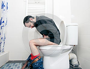 Man having problems in toilet