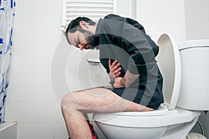 Man having problems in toilet