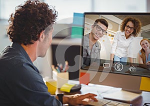 Man having video call with colleagues on computer