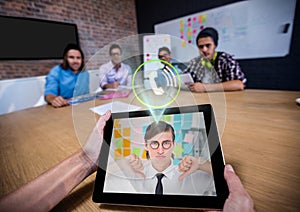 Man having a video call with his colleague on digital tablet