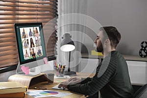 Man having video chat with colleagues at table. Team work